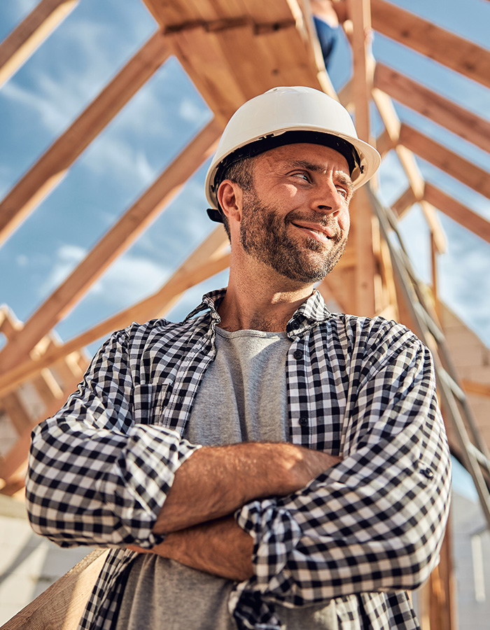Worker with folded arms smiling